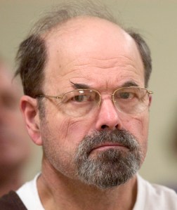 Convicted BTK killer Dennis Rader listens during a court proceding Wednesday, Oct. 12, 2005, at the El Dorado Correctional Facility in El Dorado, Kan. A judge recommended Wednesday that Rader receive treatment as a sexual offender and have restrictions on what he can receive or do in prison while he serves the rest of his life in prison for 10 murders. (AP Photo/Travis Heying, Pool)